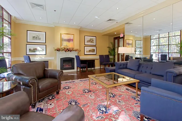 a living room with furniture fireplace and window