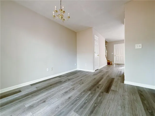 a view of a livingroom with wooden floor