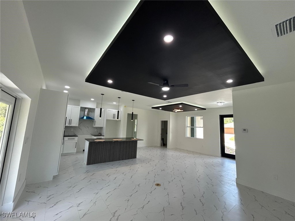 4204 East 24th Street Alva, FL 33920 - Photo 16 of 34 a view of a big room with wooden floor and windows