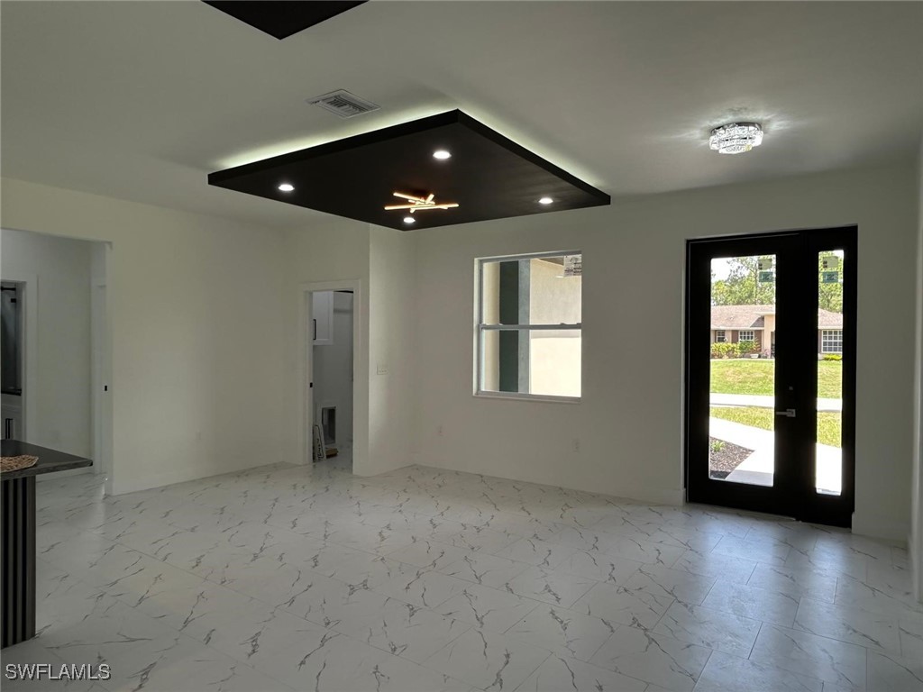 4204 East 24th Street Alva, FL 33920 - Photo 17 of 34 an empty room with wooden floor and windows