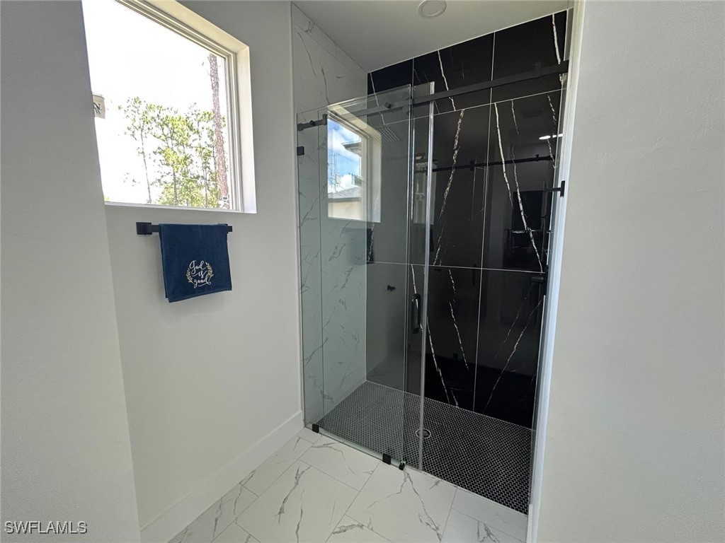 4204 East 24th Street Alva, FL 33920 - Photo 24 of 34 a bathroom with a shower and a sink