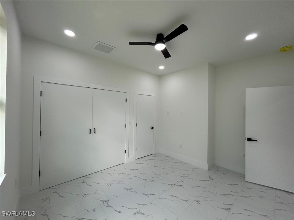 4204 East 24th Street Alva, FL 33920 - Photo 26 of 34 an empty room with ceiling fan