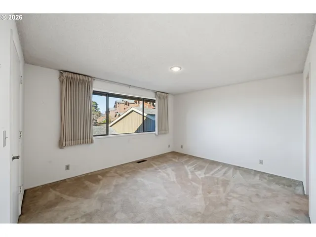 a view of an empty room with window