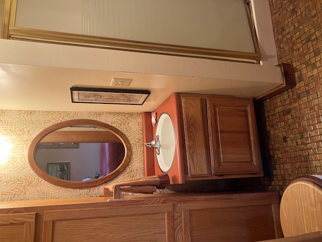 2066 Tolbert Road Hamilton, OH 45011 - Photo 24 of 63 This bright bathroom features a vanity with ample storage and a sleek sink.