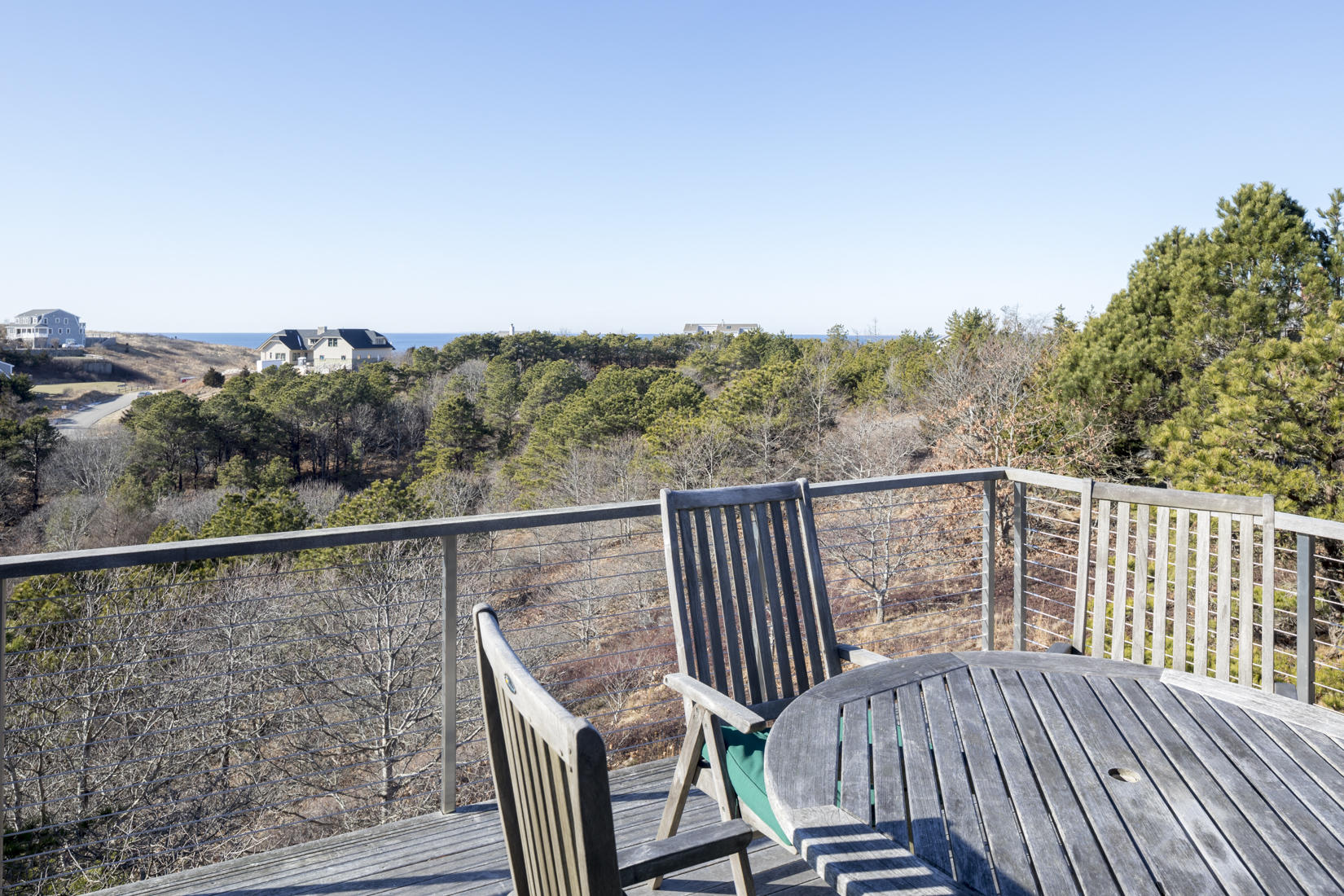 3 High Ridge Road Truro, MA 02666 - Photo 14 of 43 a view of a balcony with wooden floor and fence