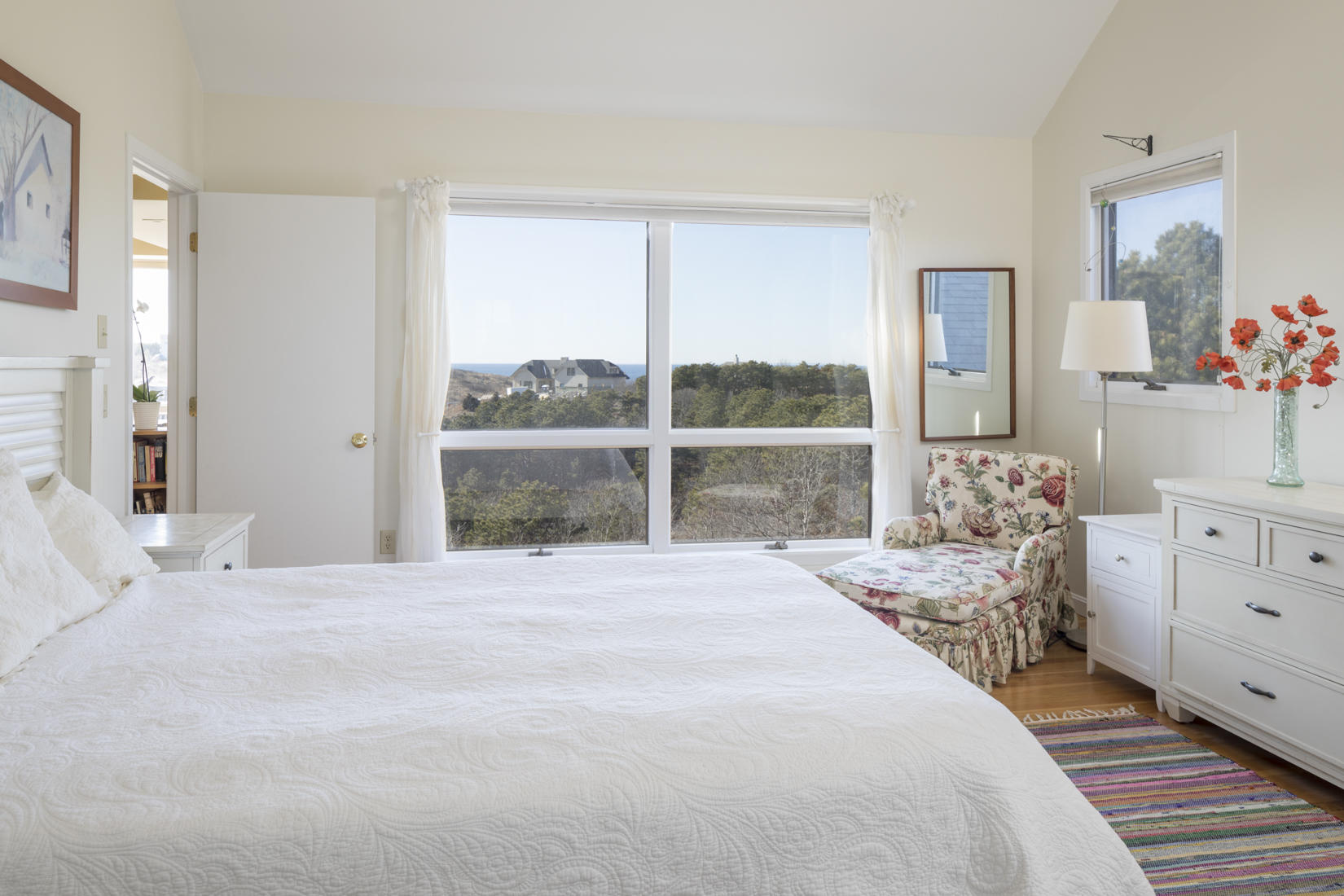 3 High Ridge Road Truro, MA 02666 - Photo 19 of 43 a large bed sitting in a bedroom next to a window