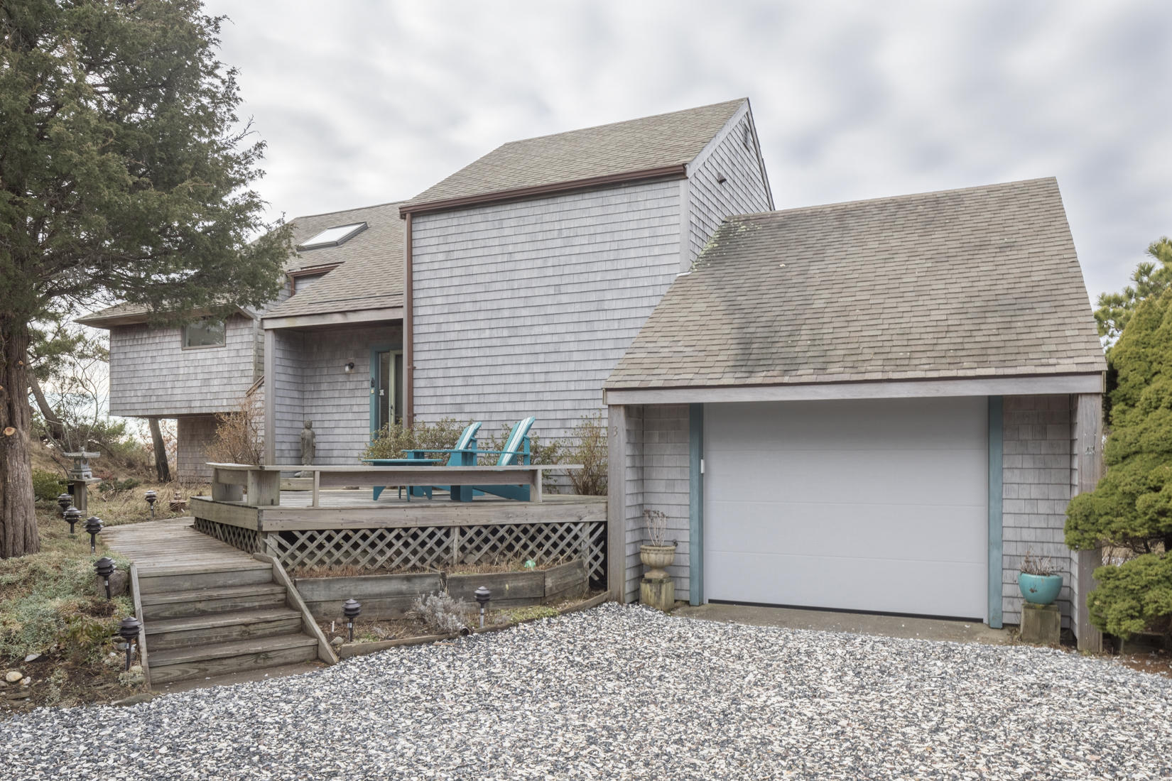 3 High Ridge Road Truro, MA 02666 - Photo 2 of 43 a front view of a house with garage