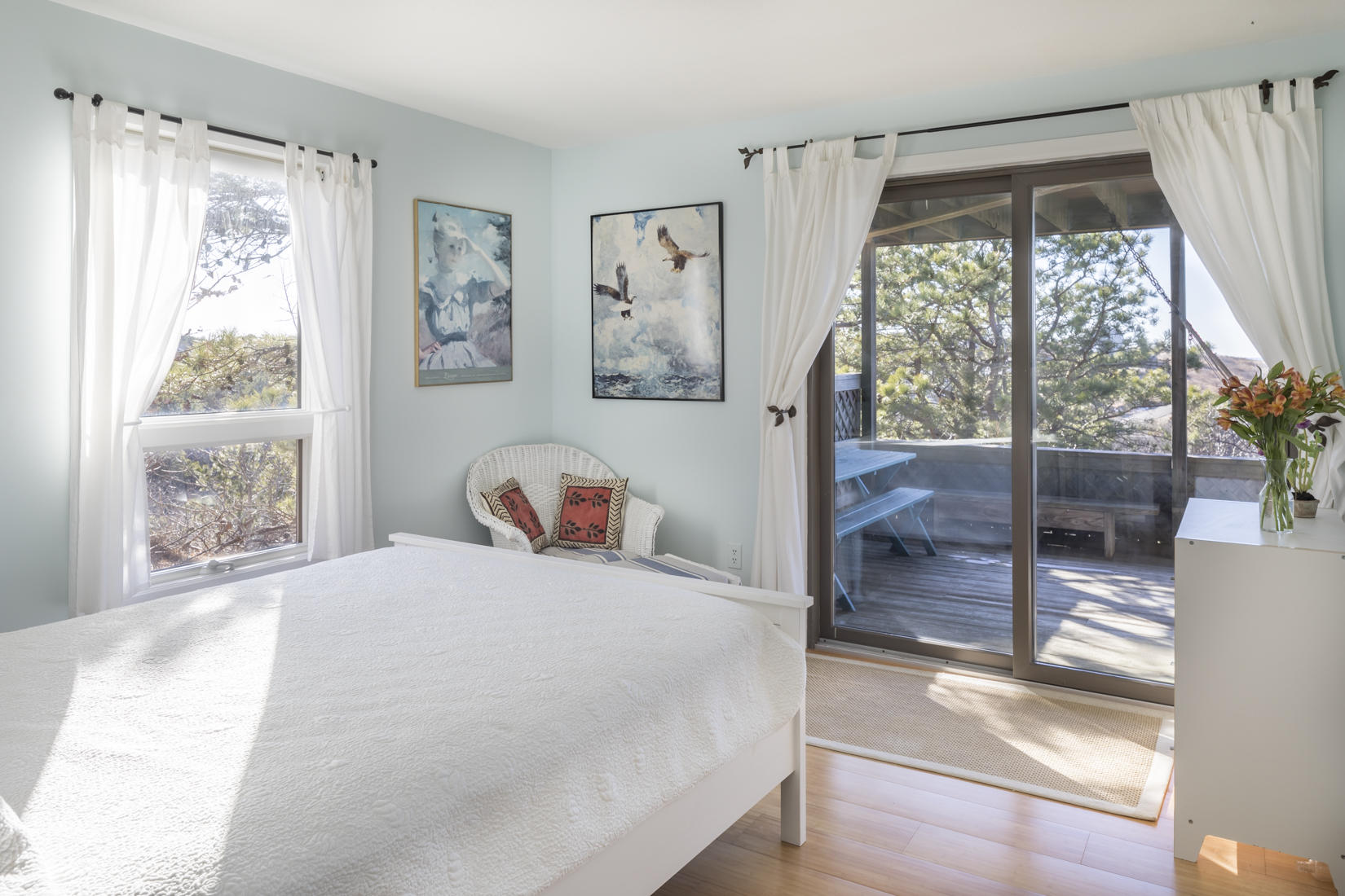 3 High Ridge Road Truro, MA 02666 - Photo 21 of 43 a bedroom with a large bed and a large window