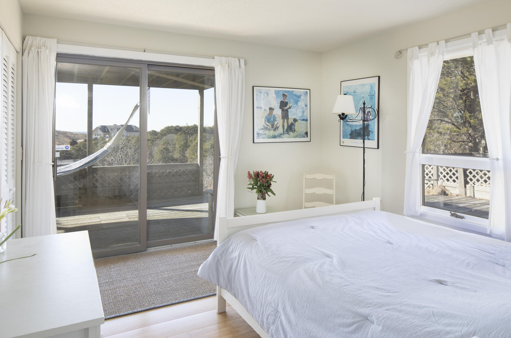 3 High Ridge Road Truro, MA 02666 - Photo 24 of 43 a bedroom with a large window and a glass door
