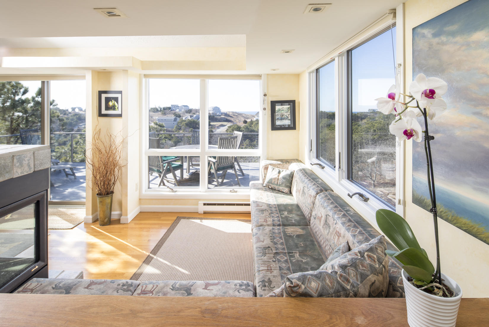 3 High Ridge Road Truro, MA 02666 - Photo 7 of 43 a living room with stainless steel appliances with a floor to ceiling window and wooden floor