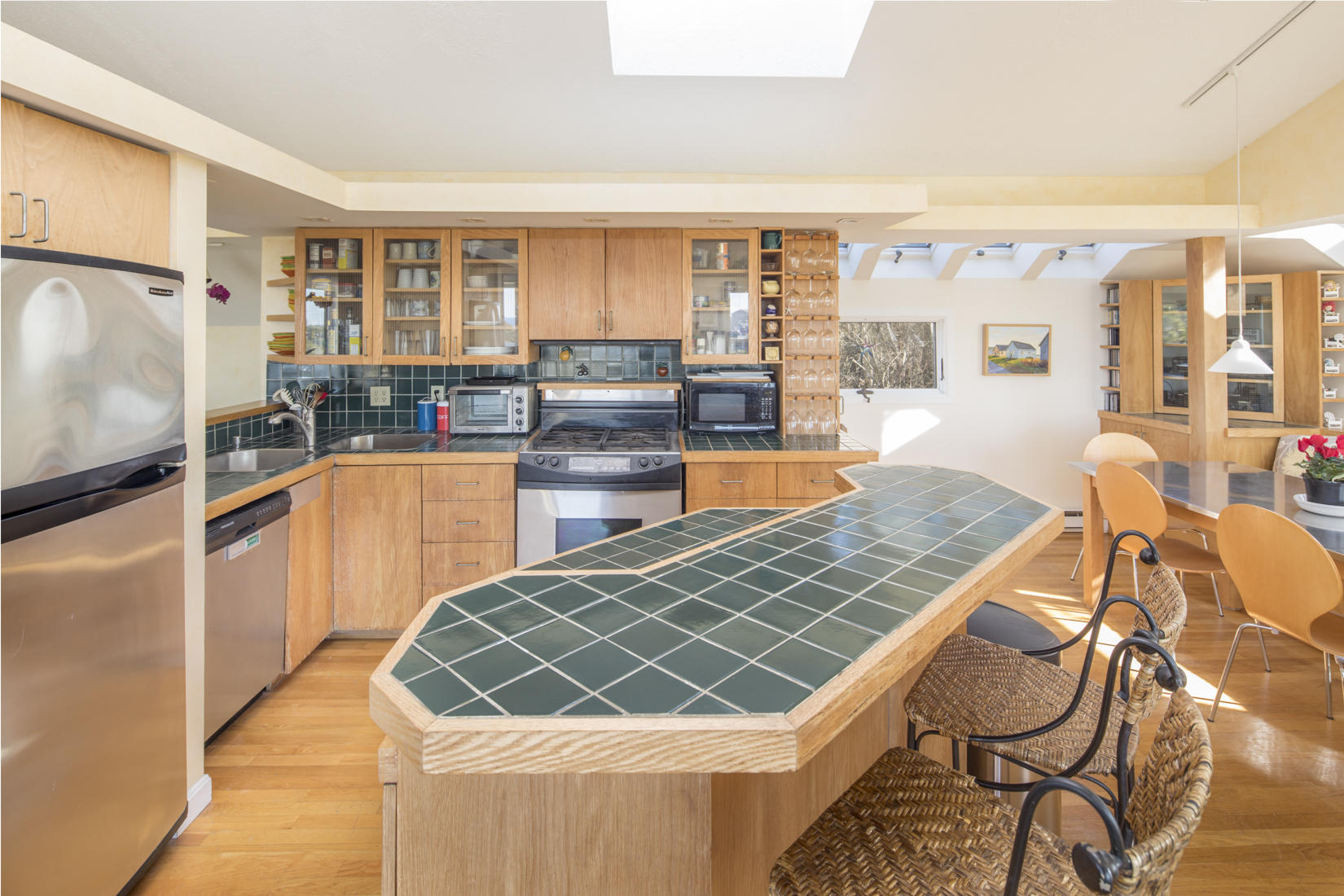 3 High Ridge Road Truro, MA 02666 - Photo 8 of 43 a kitchen with stainless steel appliances granite countertop a sink and cabinets