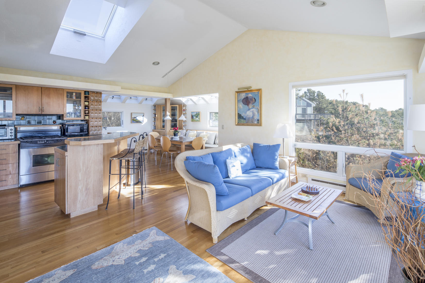 3 High Ridge Road Truro, MA 02666 - Photo 10 of 43 a living room with furniture and a kitchen view