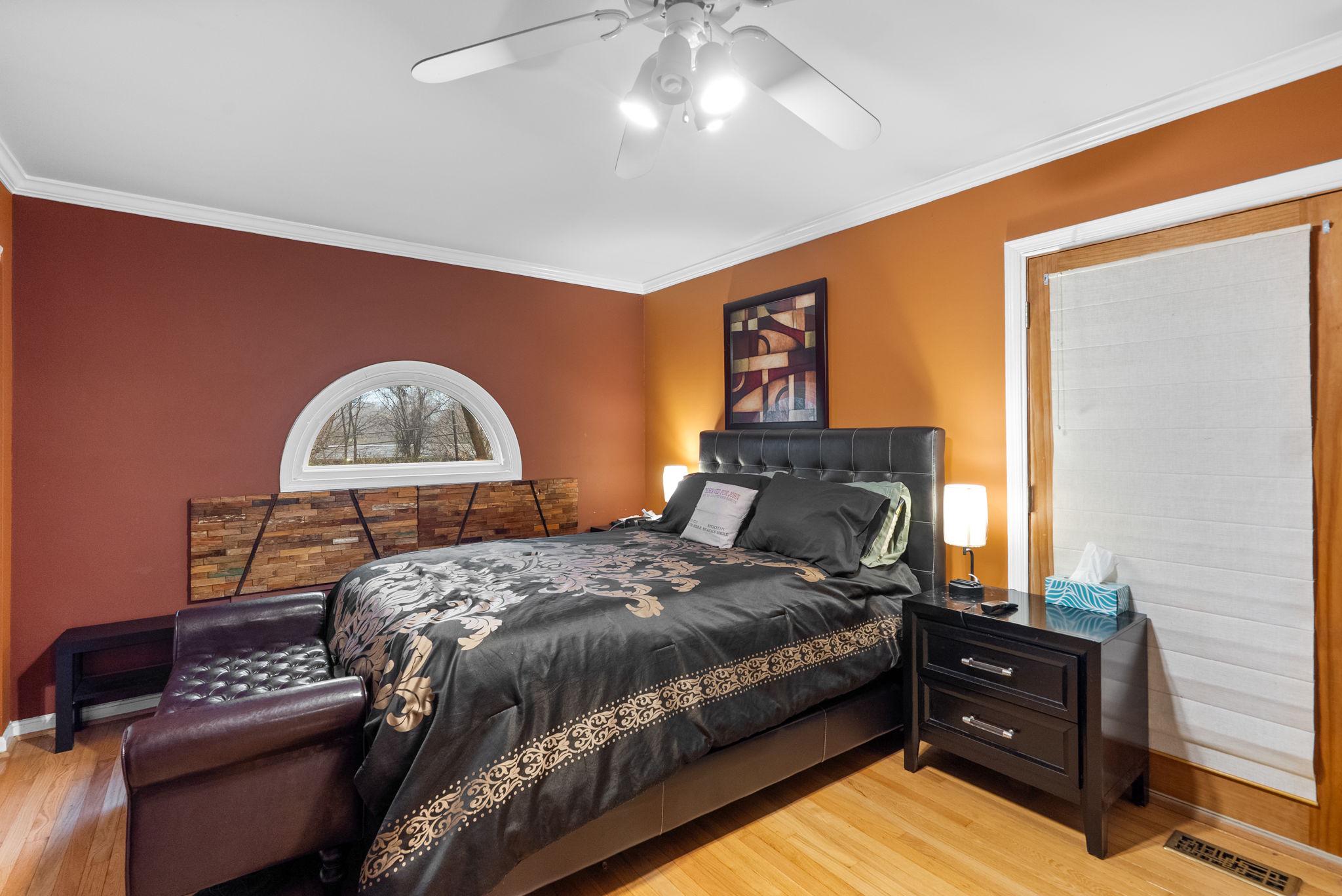 13100 Croom Road Upper Marlboro, MD 20772 - Photo 14 of 34 a bedroom with a bed and a painting on the wall