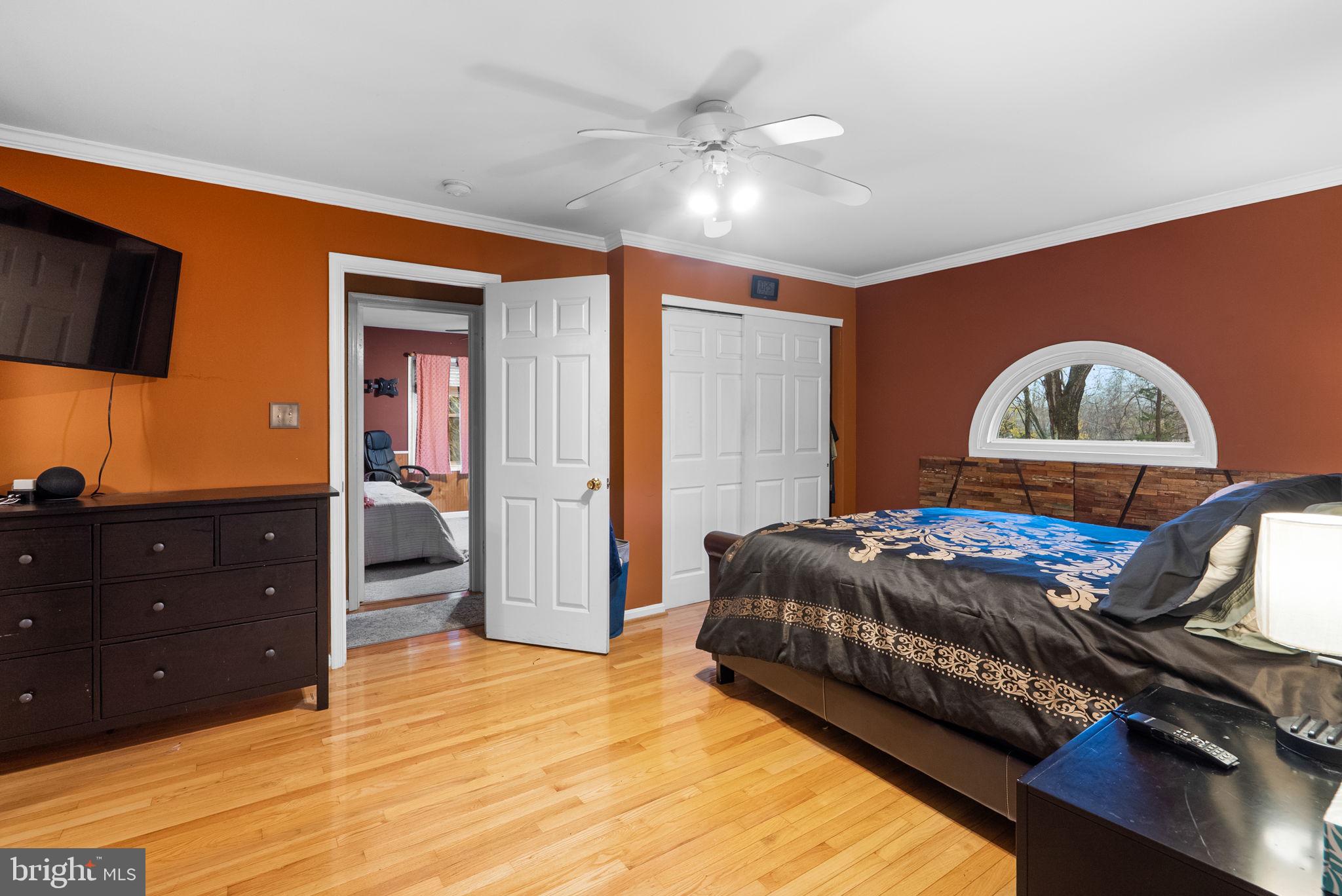 13100 Croom Road Upper Marlboro, MD 20772 - Photo 16 of 37 a bedroom with a bed and a dresser