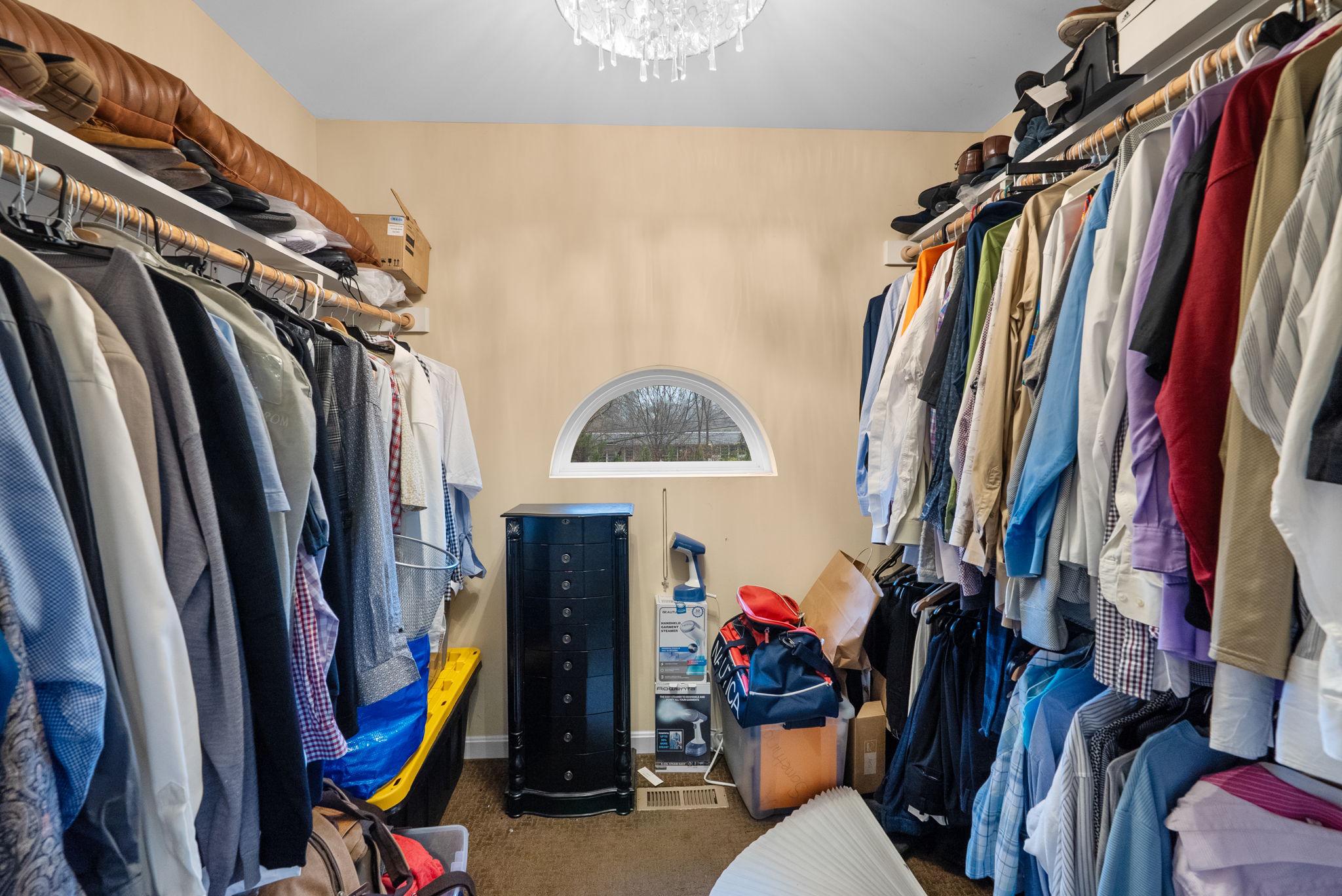 13100 Croom Road Upper Marlboro, MD 20772 - Photo 20 of 34 a view of walk in closet with clothes and shoes