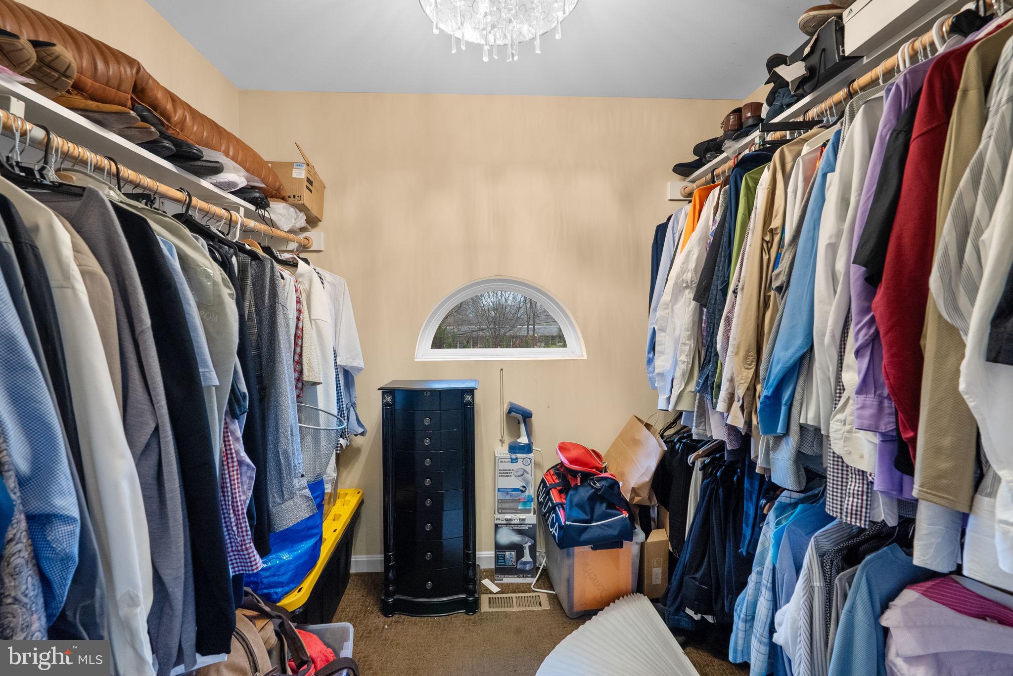 13100 Croom Road Upper Marlboro, MD 20772 - Photo 20 of 37 a view of walk in closet with clothes and shoes