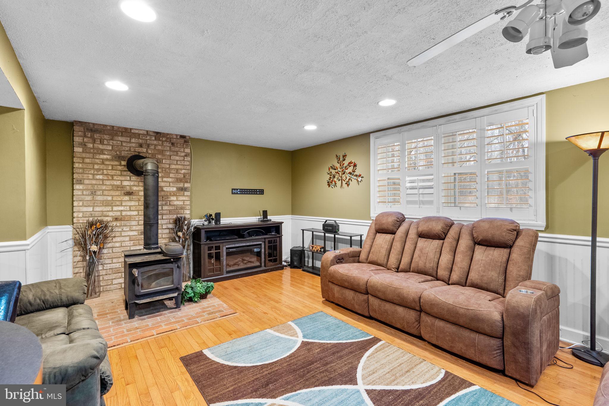 13100 Croom Road Upper Marlboro, MD 20772 - Photo 27 of 37 a living room with furniture window and wooden floor