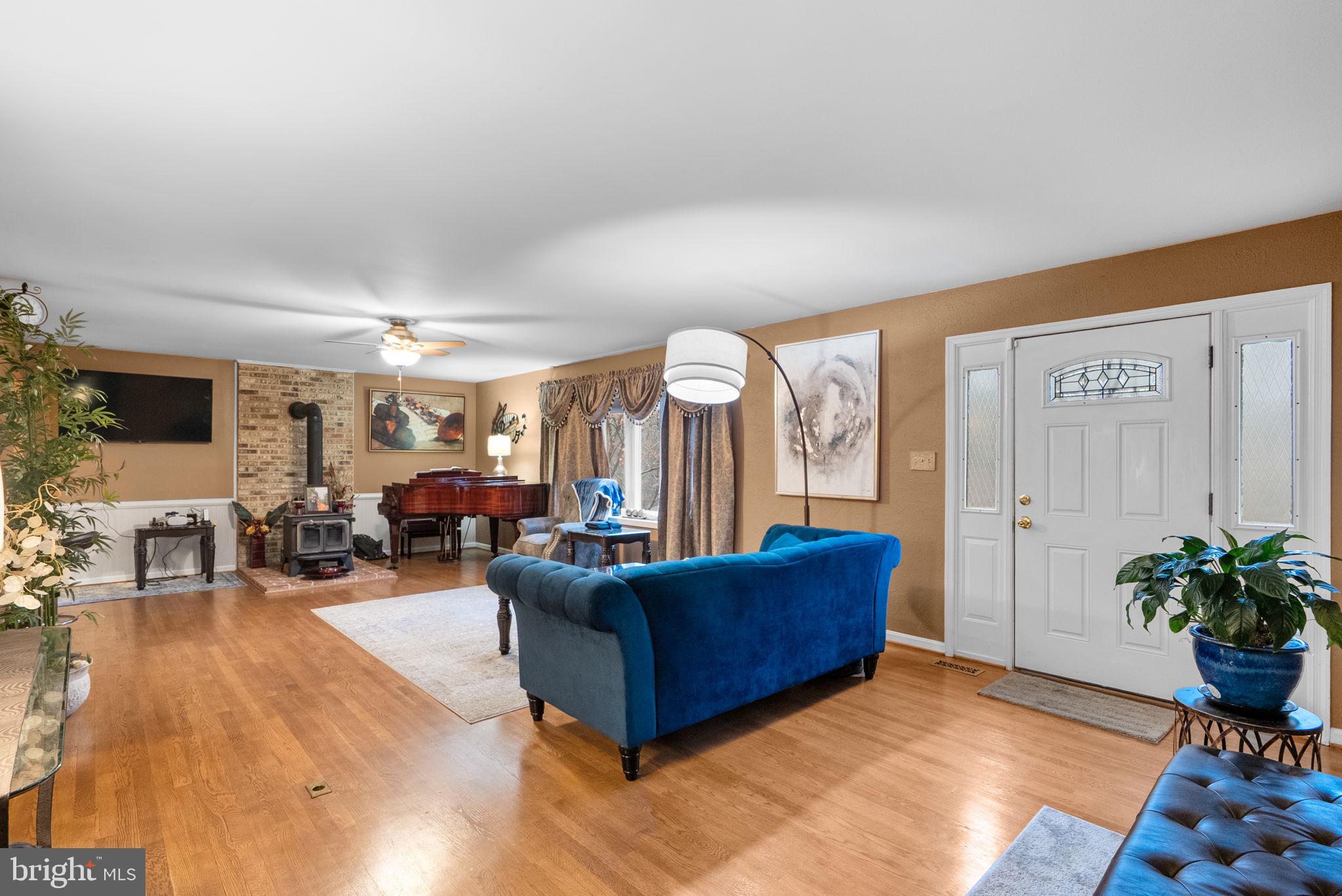 13100 Croom Road Upper Marlboro, MD 20772 - Photo 5 of 37 a living room with furniture potted plant and a large window