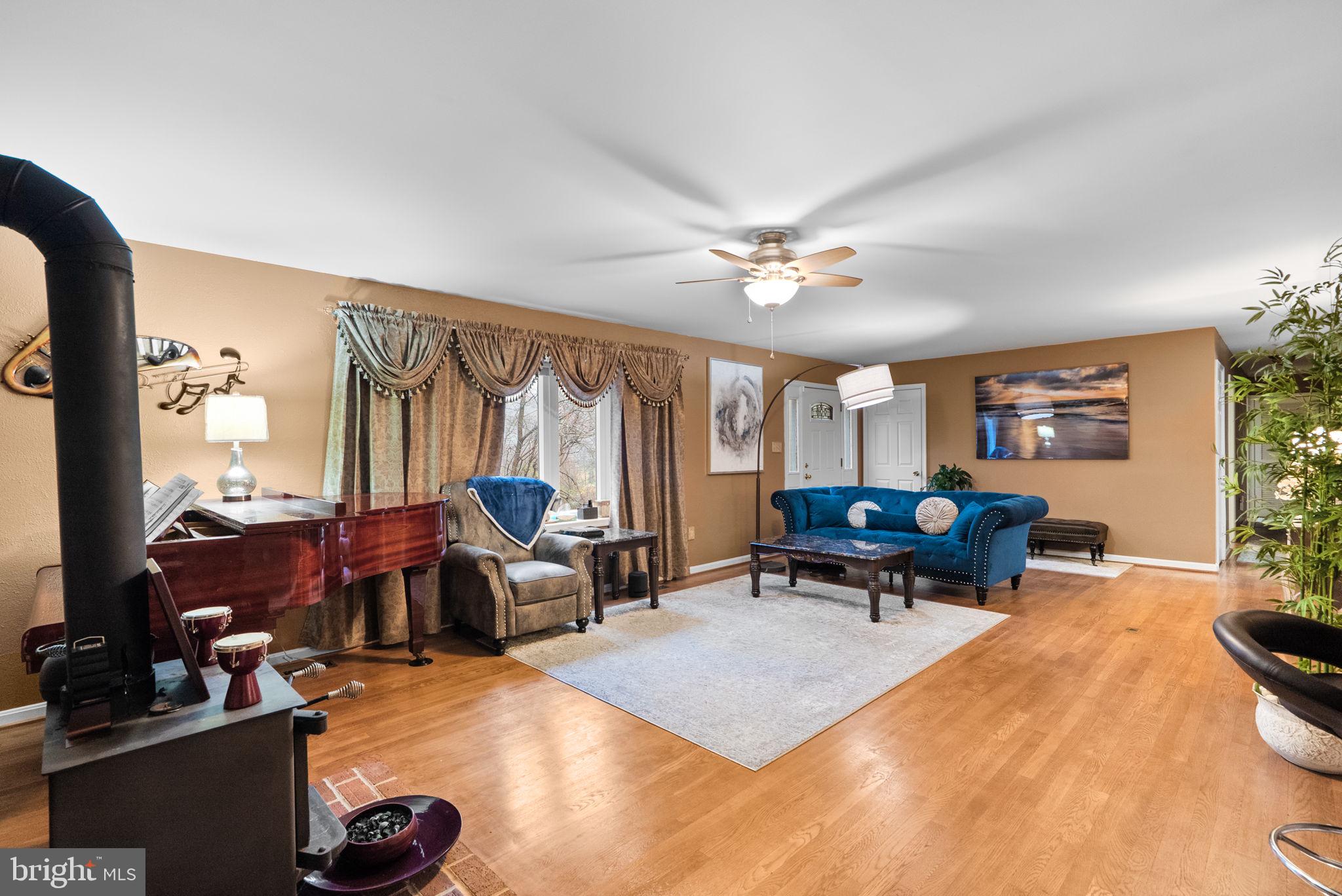 13100 Croom Road Upper Marlboro, MD 20772 - Photo 6 of 37 a living room with furniture and a large window