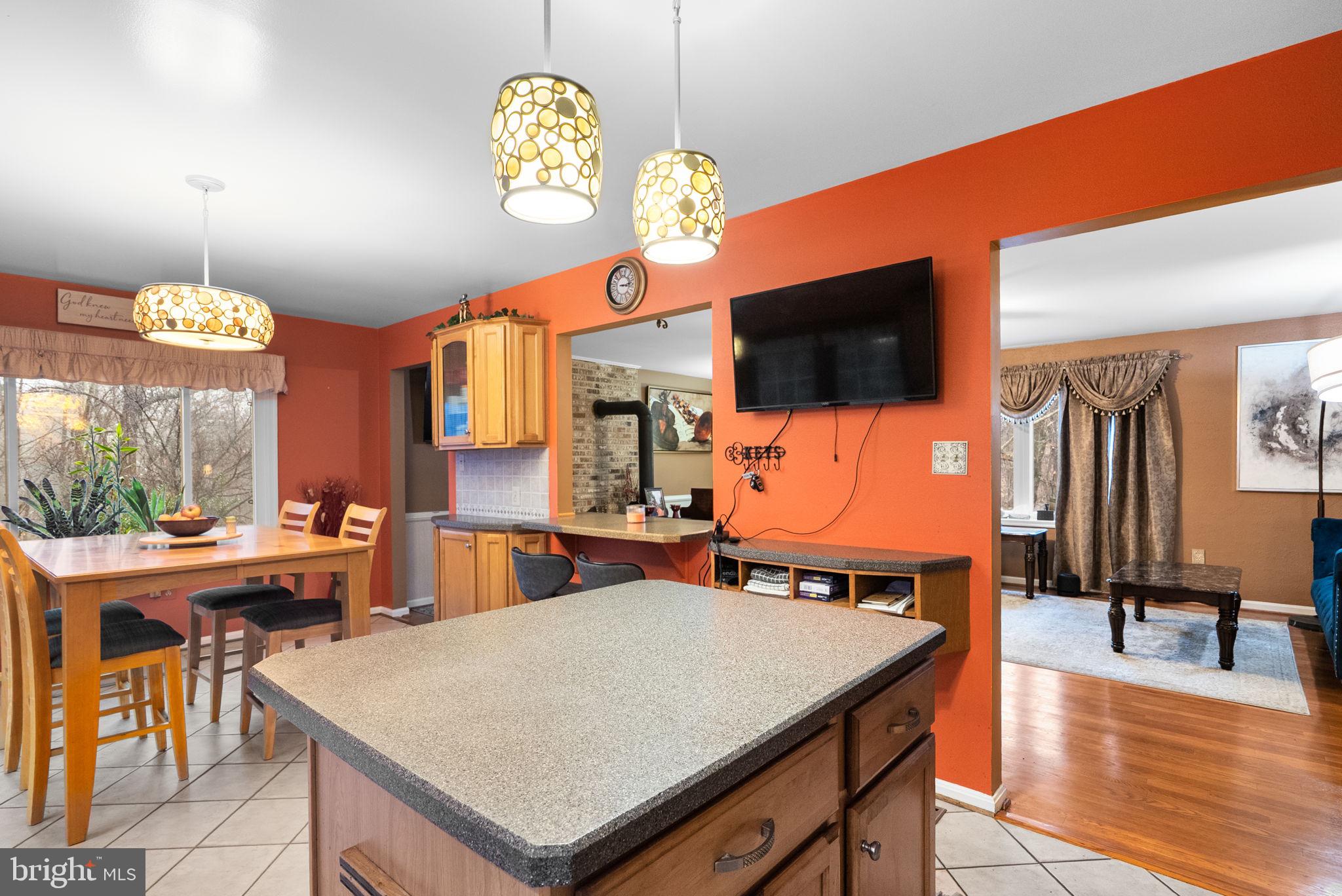 13100 Croom Road Upper Marlboro, MD 20772 - Photo 9 of 37 a view of a dining room with furniture window and wooden floor