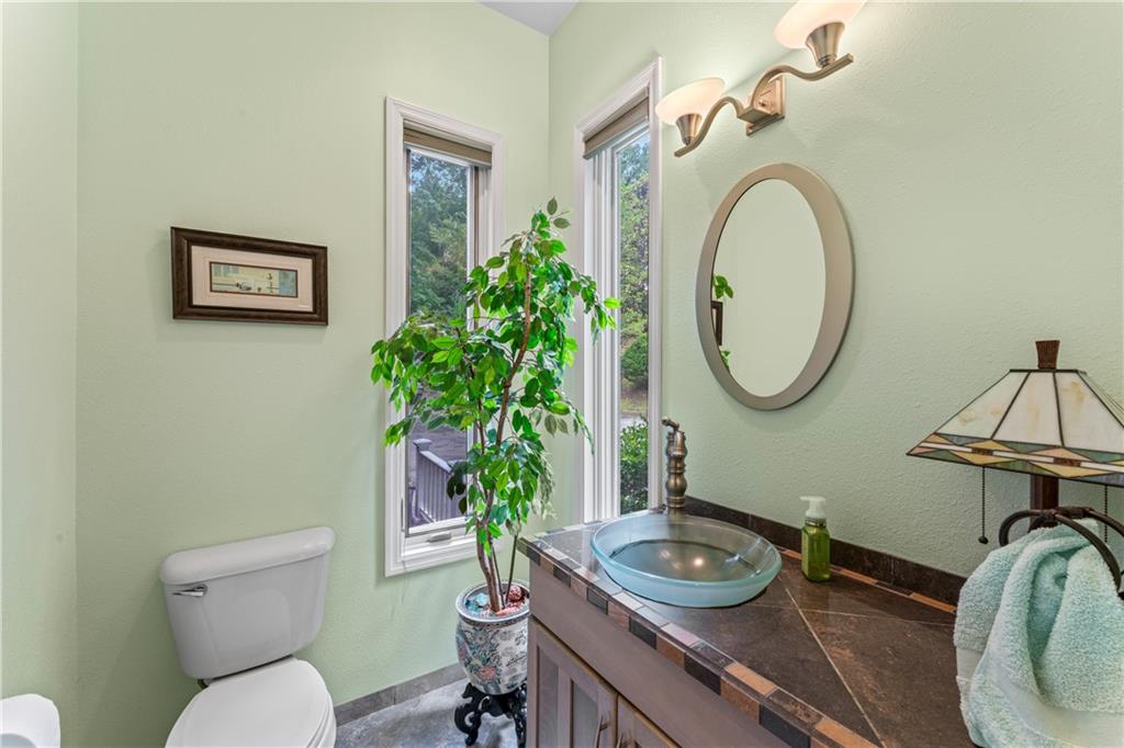 320 Holly Lane Walhalla, SC 29691 - Photo 27 of 41 This bright bathroom features ample natural light and a unique glass basin.