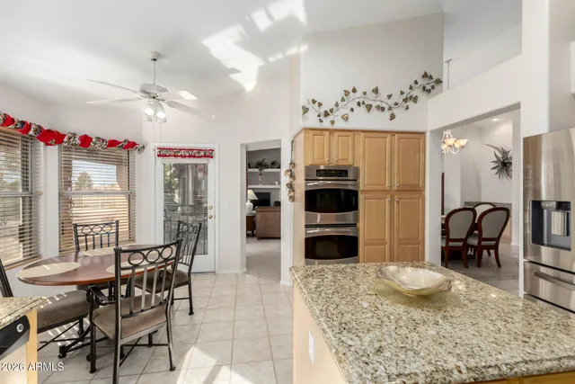 a view of a dining room kitchen and a chandelier