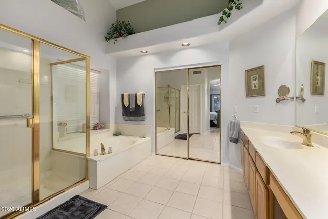 a bathroom with a bathtub shower and sink