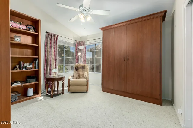 a view of a livingroom with furniture and staircase