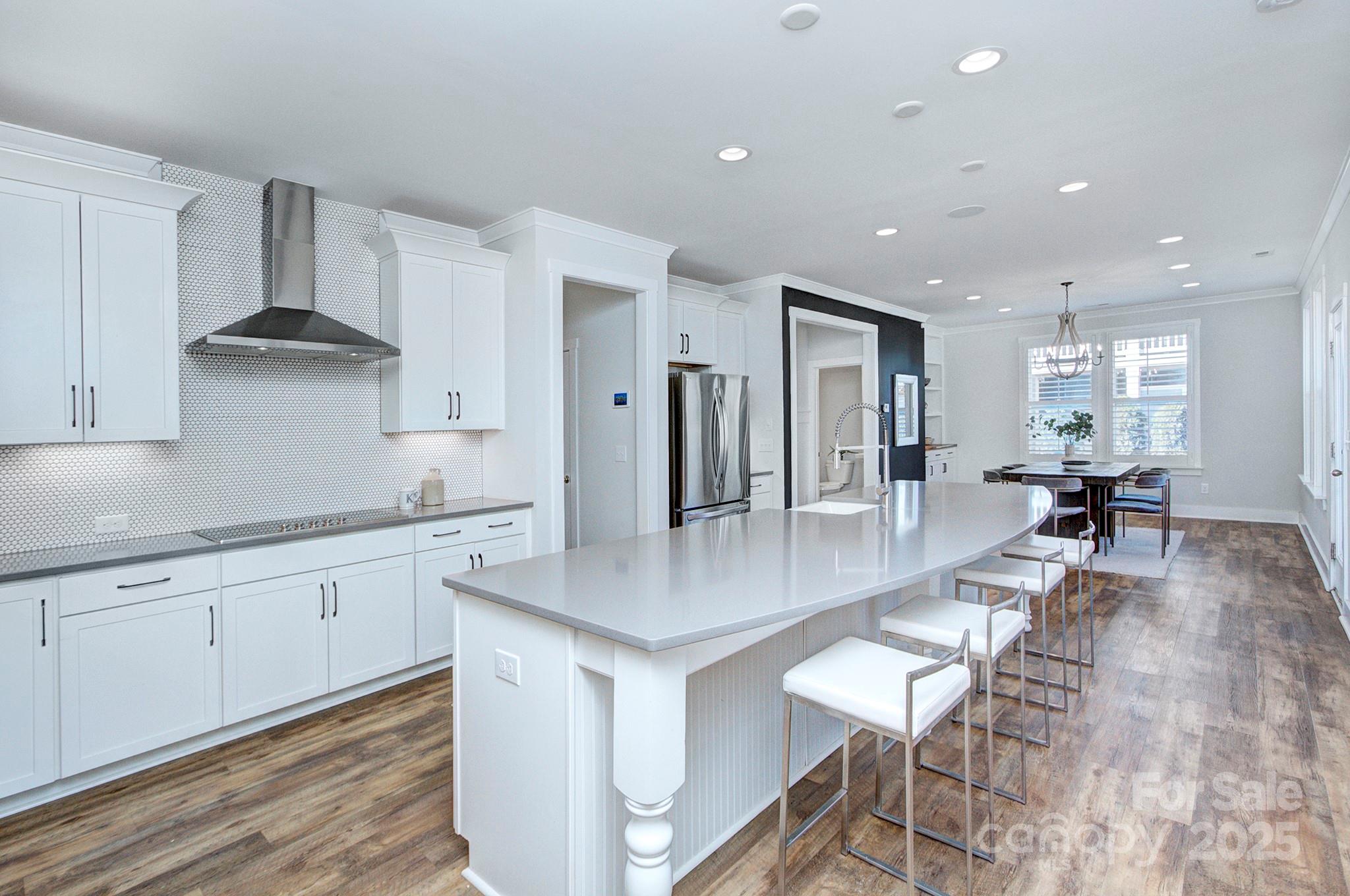 1176 Weir Court Fort Mill, SC 29708 - Photo 14 of 35 a large kitchen with stainless steel appliances lots of counter space and breakfast area