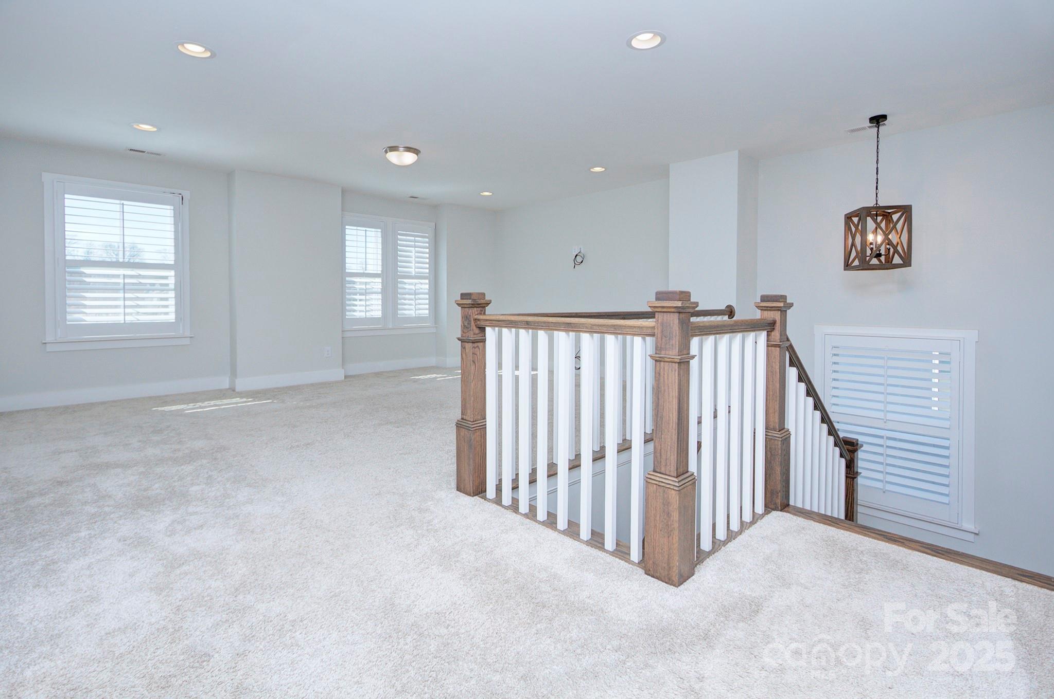 1176 Weir Court Fort Mill, SC 29708 - Photo 19 of 35 a view of a hallway with windows