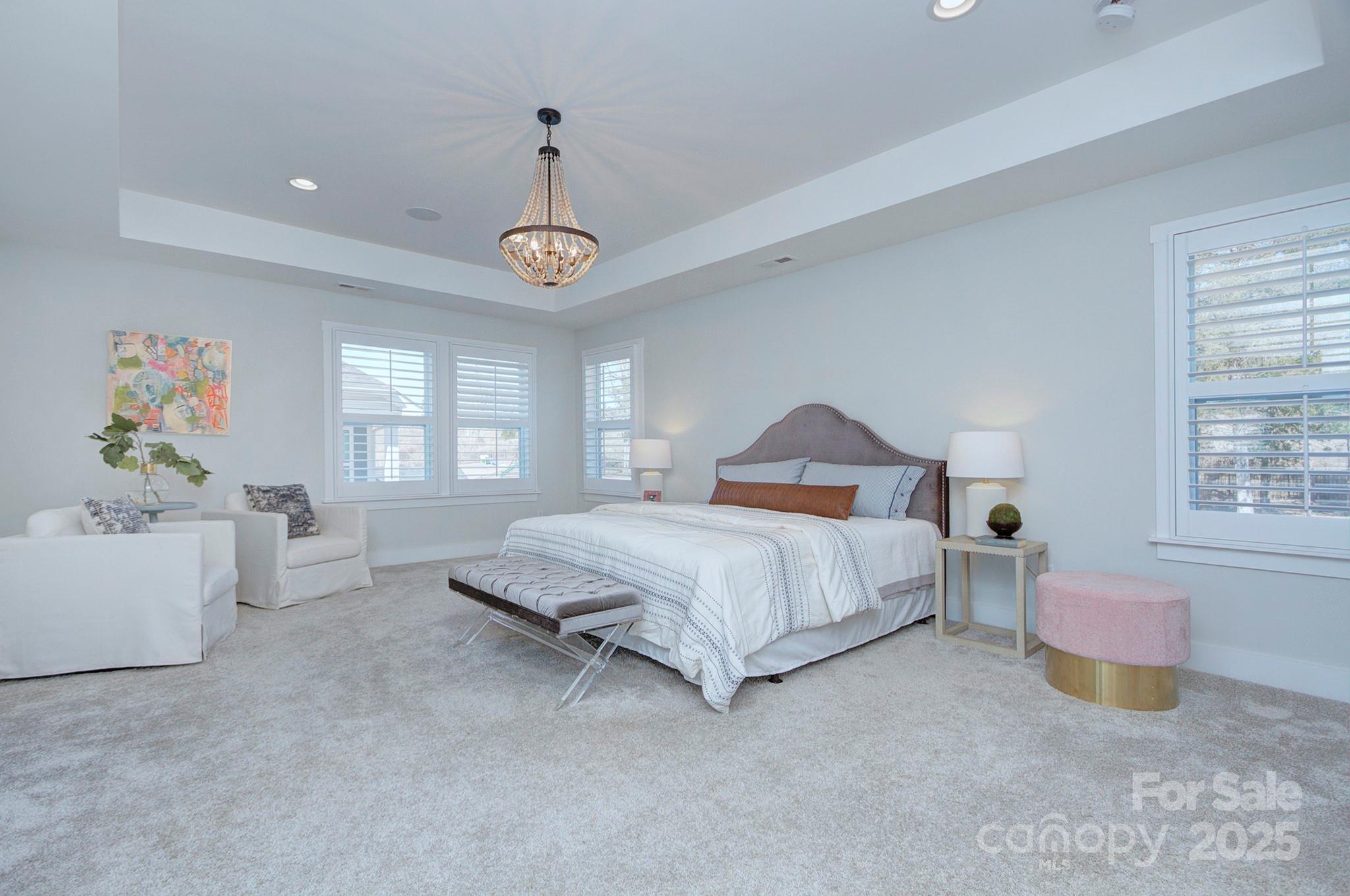 1176 Weir Court Fort Mill, SC 29708 - Photo 20 of 35 a spacious bedroom with a bed and a window