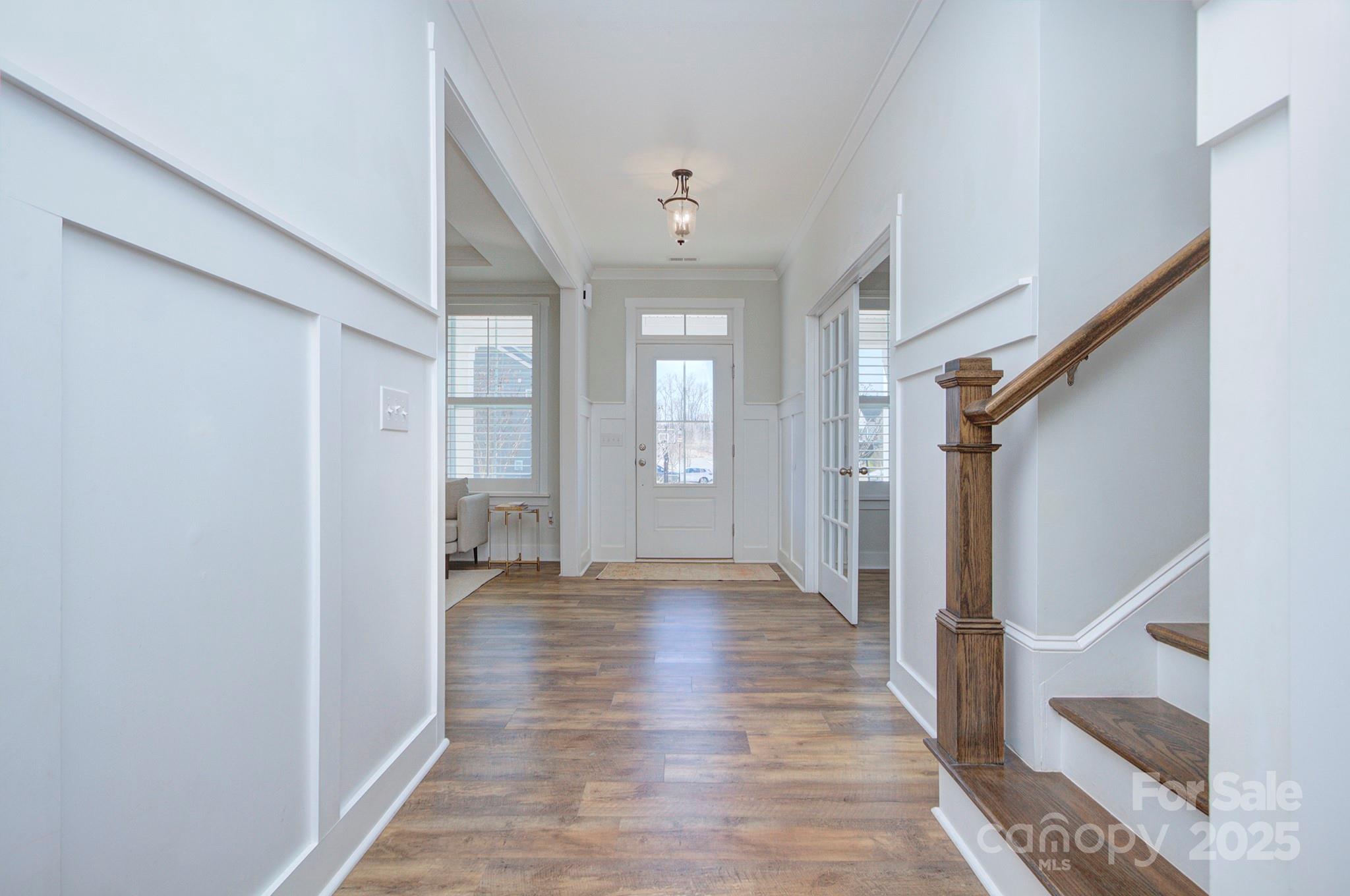 1176 Weir Court Fort Mill, SC 29708 - Photo 2 of 35 a view of an empty room with wooden floor and a window