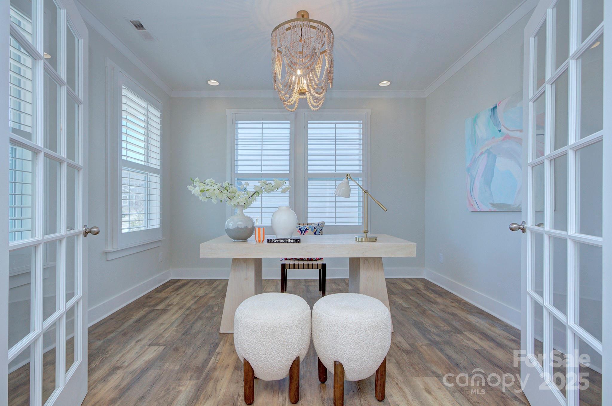 1176 Weir Court Fort Mill, SC 29708 - Photo 4 of 35 a view of a dining room with furniture window and wooden floor