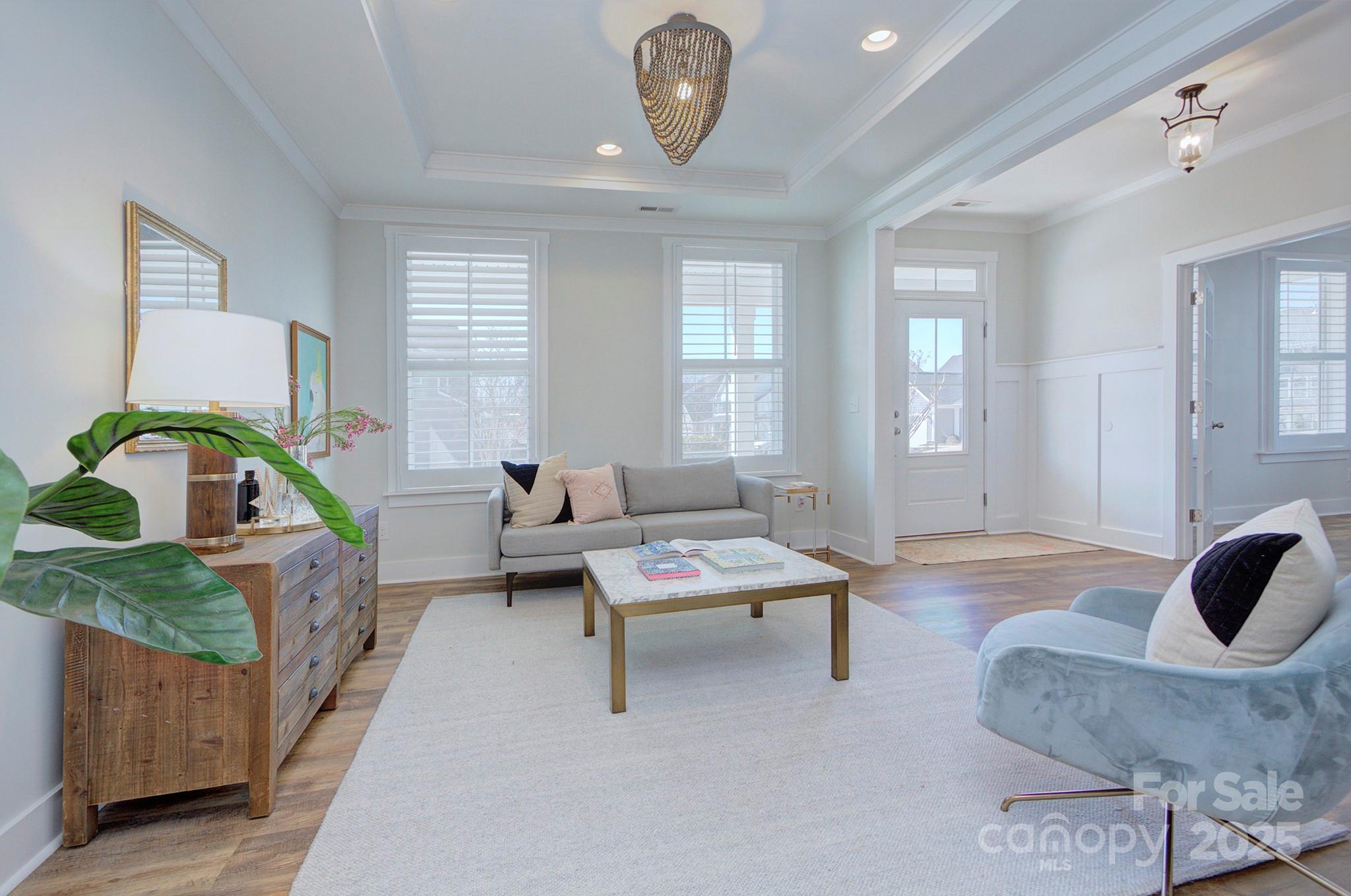 1176 Weir Court Fort Mill, SC 29708 - Photo 8 of 35 a living room with furniture and a wooden floor
