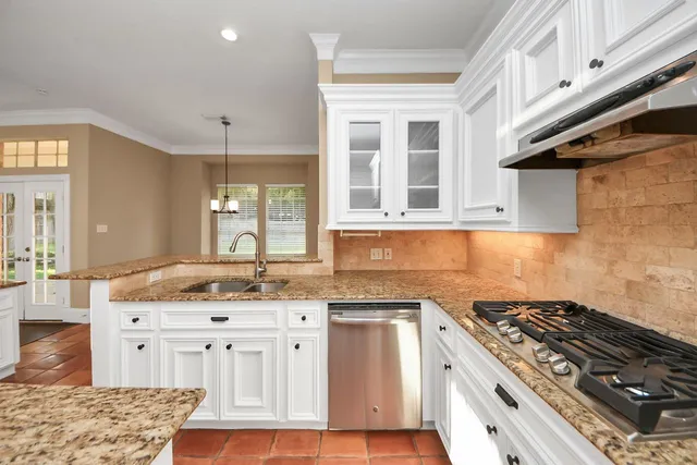 a view of an empty room with a ceiling fan