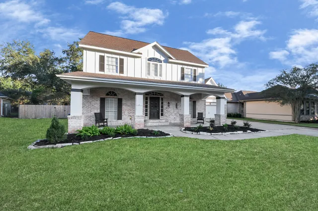 a front view of a house with a yard table and chairs