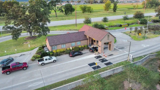 a dining room with furniture window and wooden floor