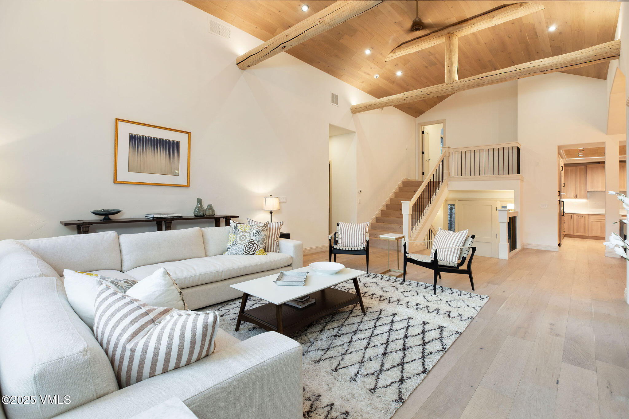 230 Castle Peak Gate, Unit B Edwards, CO 81632 - Photo 3 of 12 a living room with furniture and wooden floor