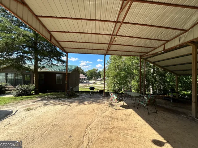 a view of a backyard with a patio