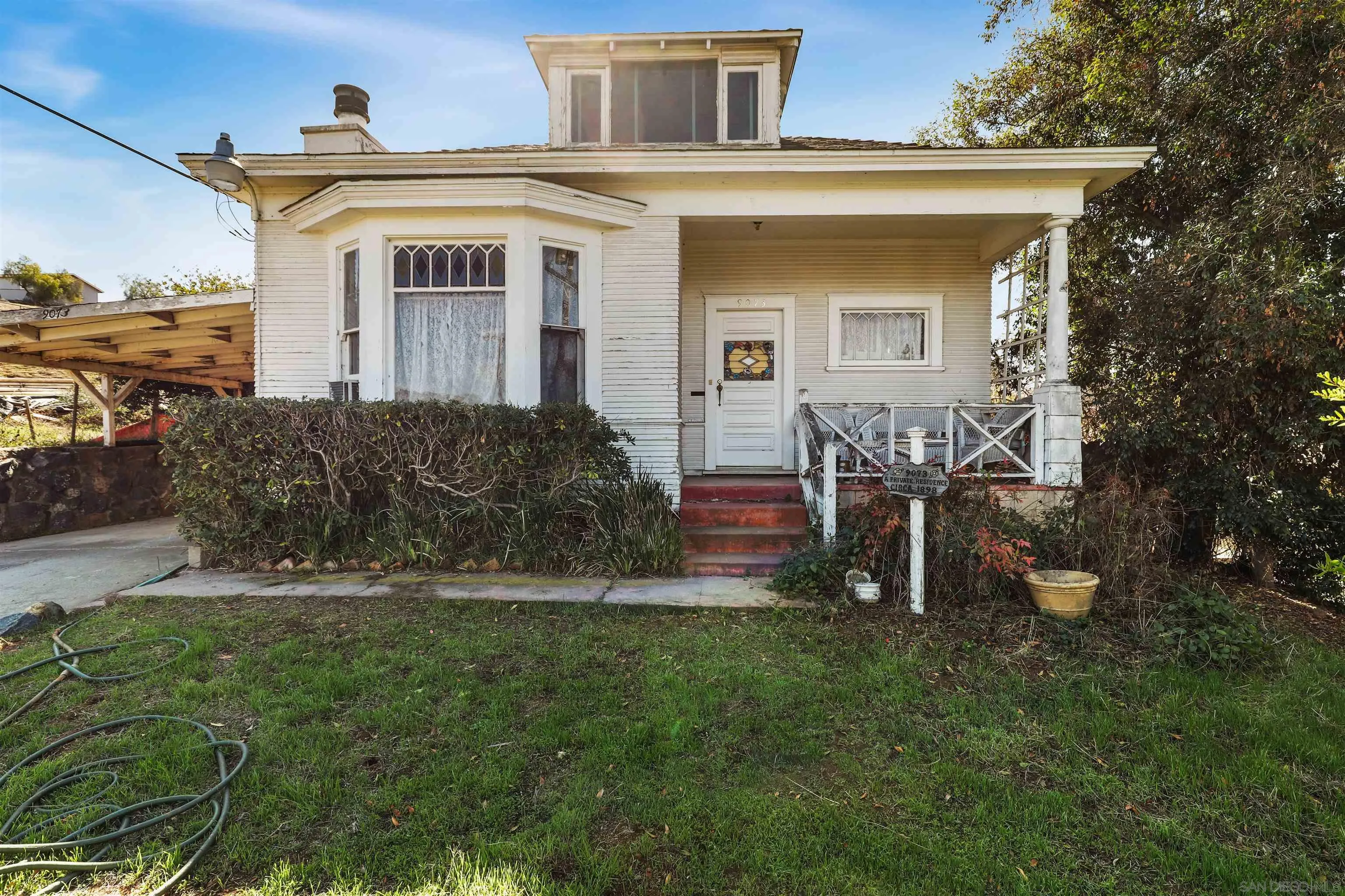 9069-73 Rosedale Court Spring Valley, CA 91977 - Photo 1 of 47 a front view of a house with a yard