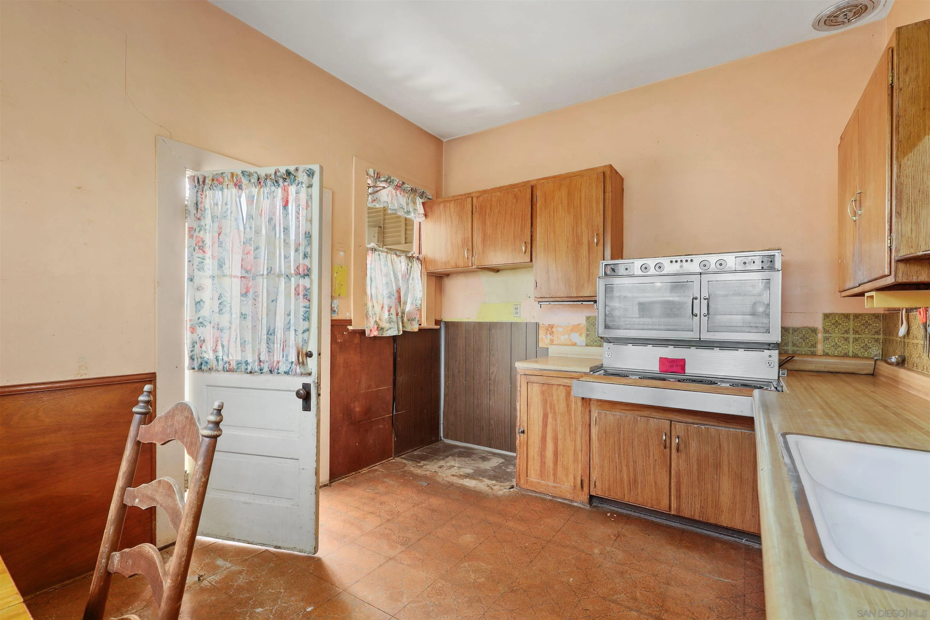 9069-73 Rosedale Court Spring Valley, CA 91977 - Photo 10 of 47 a room with furniture and a kitchen view