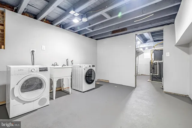 a utility room with dryer and washer