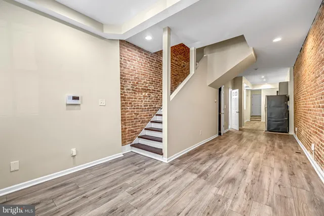 a view of entryway with wooden floor