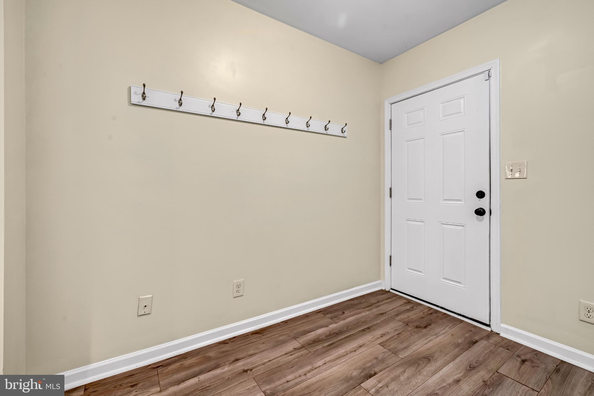 2131 Jefferson Street Baltimore, MD 21205 - Photo 8 of 24 a view of a room with wooden floor