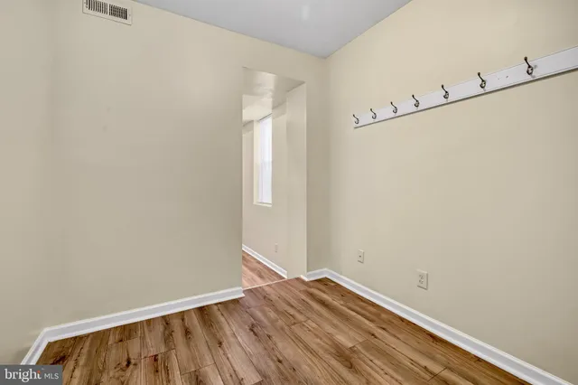 a view of small space with wooden floor