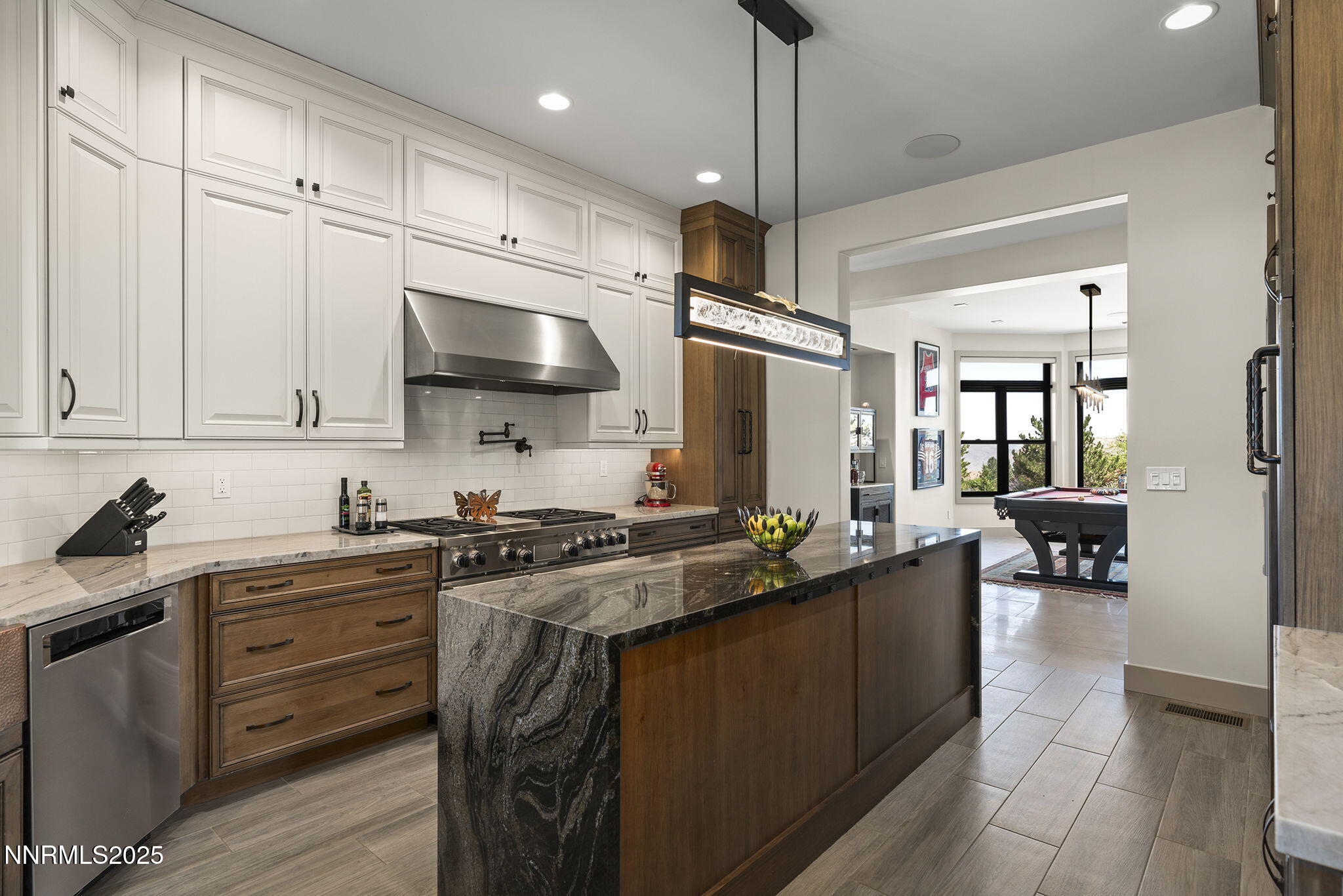 6177 North Featherstone Circle Reno, NV 89511 - Photo 12 of 72 a kitchen with a stove a sink and a refrigerator