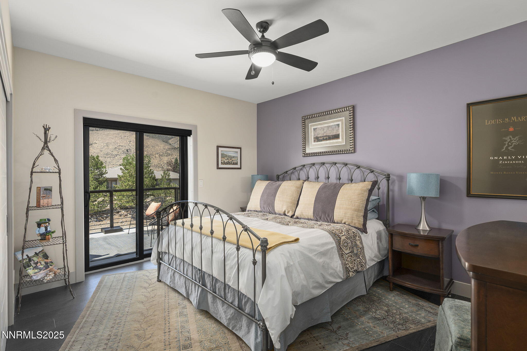 6177 North Featherstone Circle Reno, NV 89511 - Photo 37 of 72 a bedroom with a large bed and a chandelier