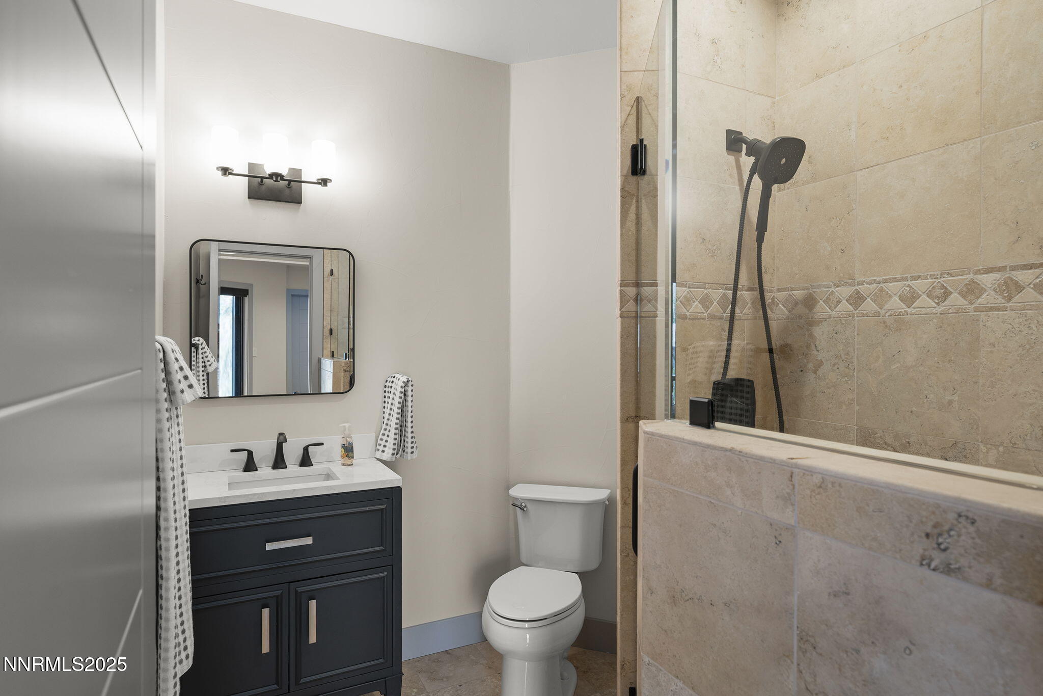 6177 North Featherstone Circle Reno, NV 89511 - Photo 40 of 72 a bathroom with a sink a toilet and shower