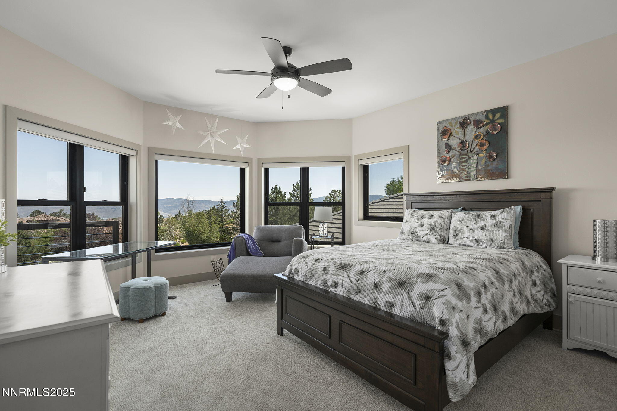 6177 North Featherstone Circle Reno, NV 89511 - Photo 41 of 72 a bedroom with a bed a couch and a large window