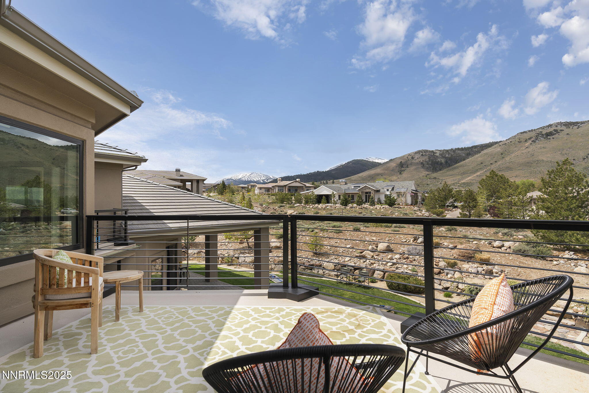 6177 North Featherstone Circle Reno, NV 89511 - Photo 58 of 72 a view of a balcony with two chairs and a table